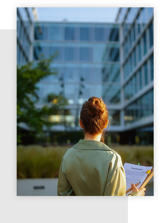Lady looking at building for real estate